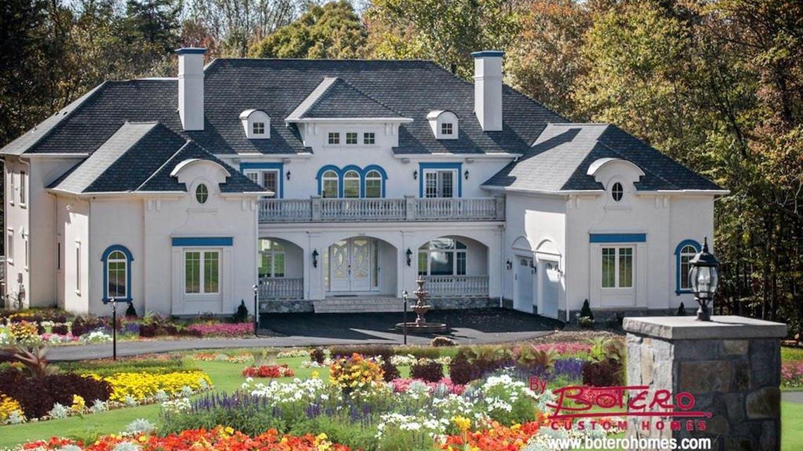 The Tuscan Villa I model built by Botero Homes. Omar Botero-Paramo, president of the company, says many of his customers are well-to-do immigrants who see mansions as a sign of success.