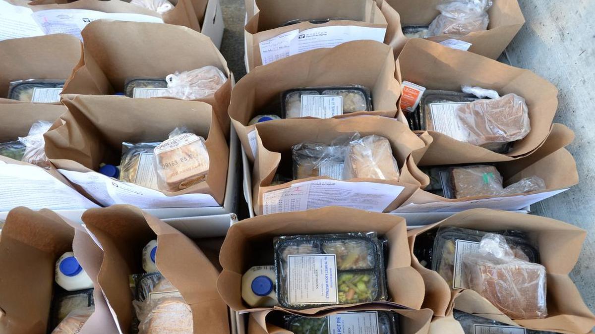
Bags with bread, milk, and frozen meals wait to be loaded at Bellingham Senior Activity Center to be delivered to the homes of seniors in Whatcom County.
