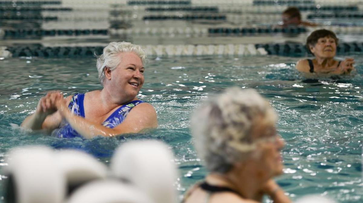 Tanja Wolf, left, participates in an arthritis exercise class at Arne Hanna Aquatic Center in Bellingham.