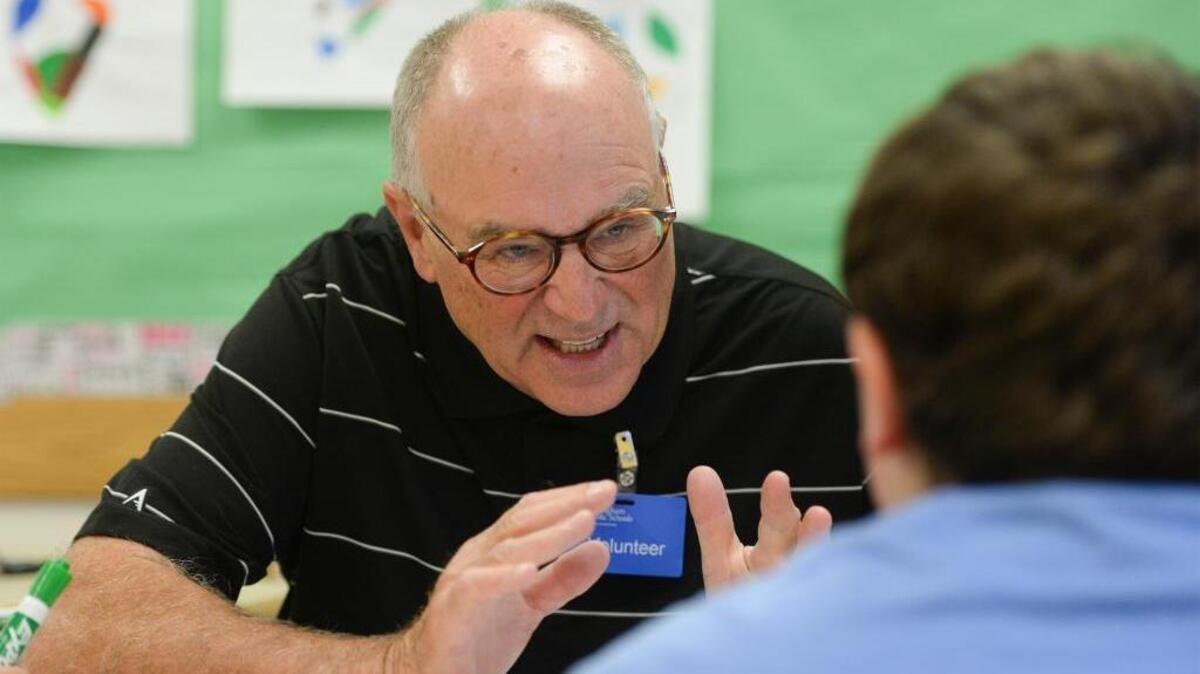Volunteer Wayne Weinschenk, 71, tutors Wyatt Bradley, 9, math in a Cordata Elementary fourth grade class in Bellingham, Thursday, Sept. 14, 2017.