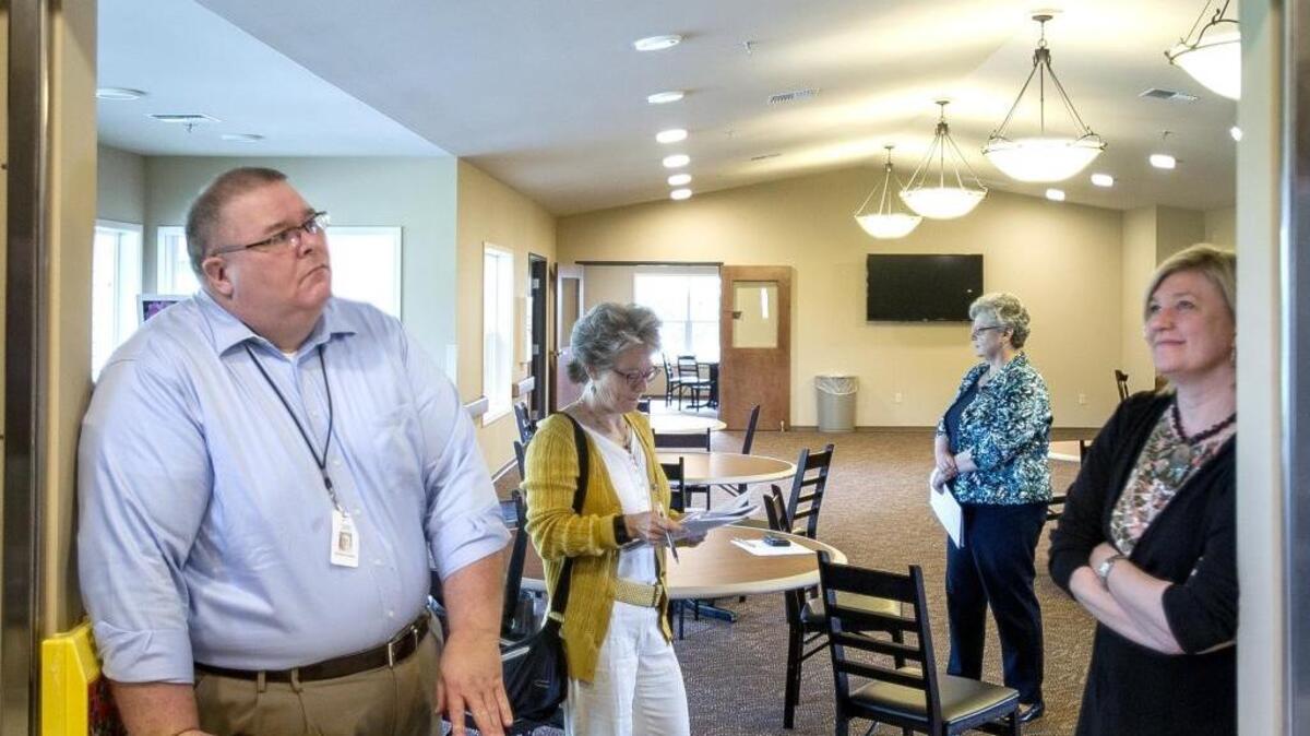 Northwest Regional Council planners Michael Duncke, left, and Kim Boon inspect the new Northwest Adult Day Health & Wellness Center with Executive Director of Christian Health Care Center, and activity coordinator and manager Mary Wynstra in Lynden in July 2015.