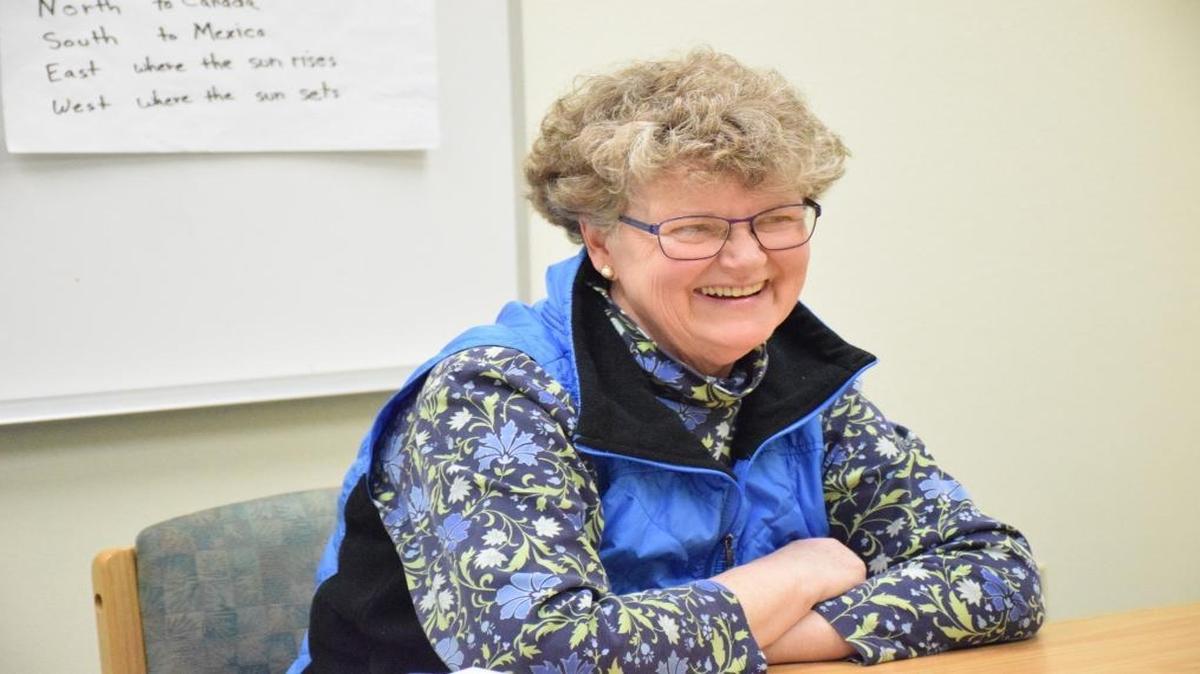 Retired teacher Meg Hayes smiles in March 2016 while tutoring a small group of adults at Lynden Library for Whatcom Literacy Council. As a volunteer tutor, Hayes works with people one-on-one and in small groups, helping them to reach their personal goals through improved literacy and English comprehension.