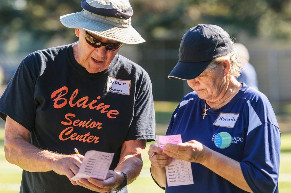 Walt Ducoing, 79, of Blaine, and Murielle Hunt, 62, of Bellingham double check their teams score during the end of the second round of the 2017 All County Bocce Tournament at Bender Fields on Monday morning August 28, 2017, in Lynden, Wash. Lynden senior center director Cathi LeCocq (cq) said 10 teams from the Lynden, Blaine, Bellingham, and Ferndale senior centers participated in the tournament. She said the seniors played to win “trophy and bragging rights” with the winner’s being named on the trophy.