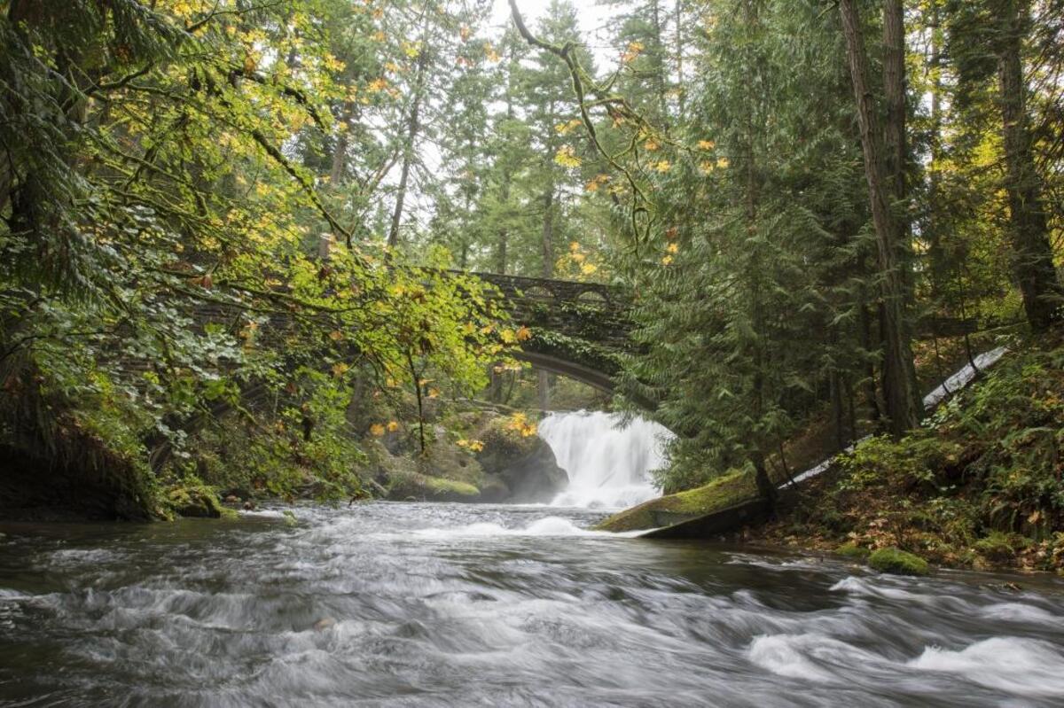 The old stone bridge above Whatcom Creek is a favorite destination at Whatcom Falls Park in Bellingham, Wash.