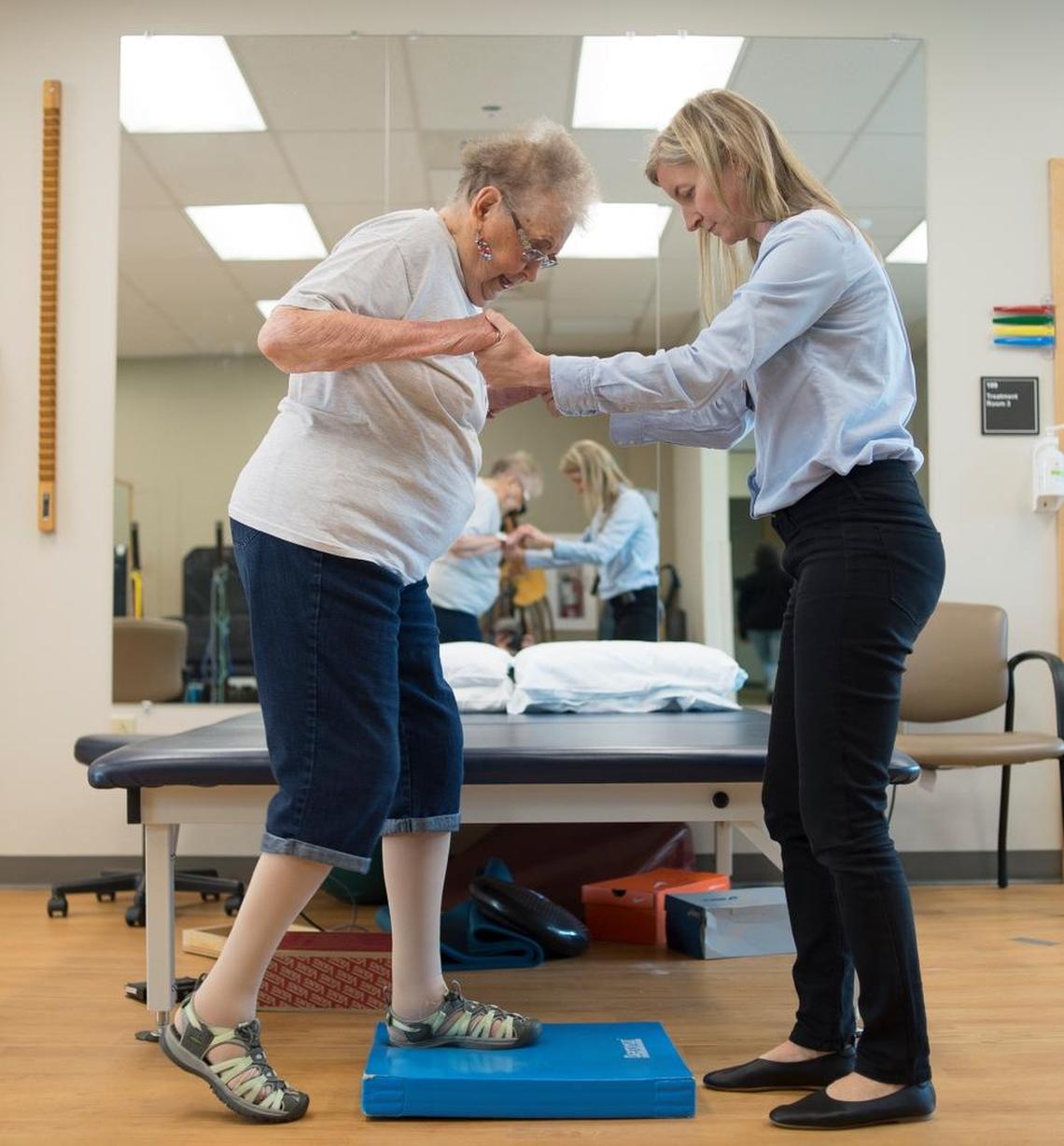 Sylvie De Rham Tortorelli, physical therapist, demonstrates fall prevention exercises with her former patient Jo Wagner on Friday, May 25, in Bellingham.