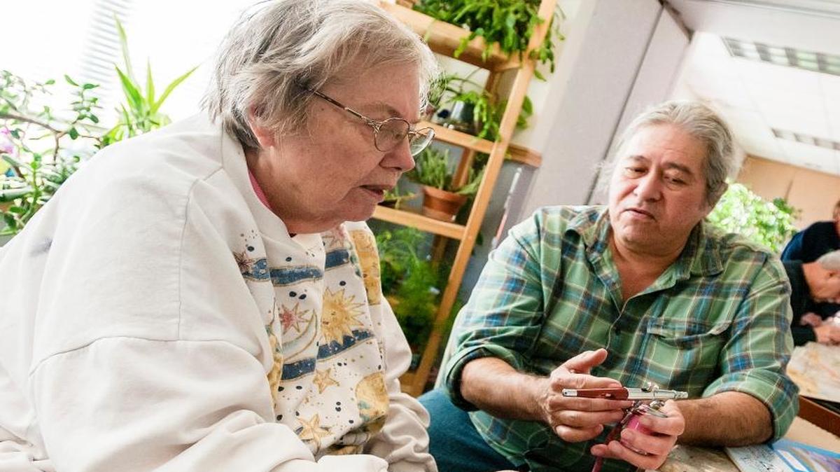 JoAn Newby, left, learns from Claude Newton how to use an airbrush during an art class Nov. 24, 2015, at Blaine Senior Center.