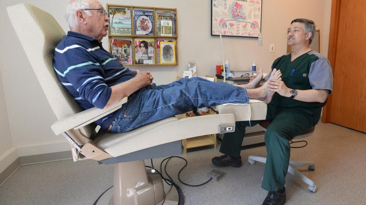 Peter T. Bogert, 75, is examined by Dr. Michael Sherwin at Family Foot Care, June 2 in Bellingham. The podiatrist says more than 50 percent of his practice is caring for the feet of senior citizens.