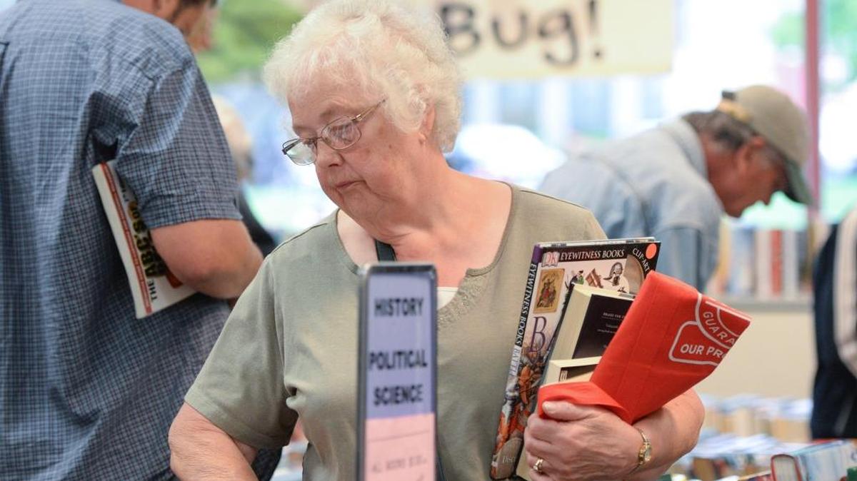 Donna Warren, 75, of Bellingham, looks for history books for her husband at the annual Ski to Sea Book Sale in May at the Bellingham Public Library.
