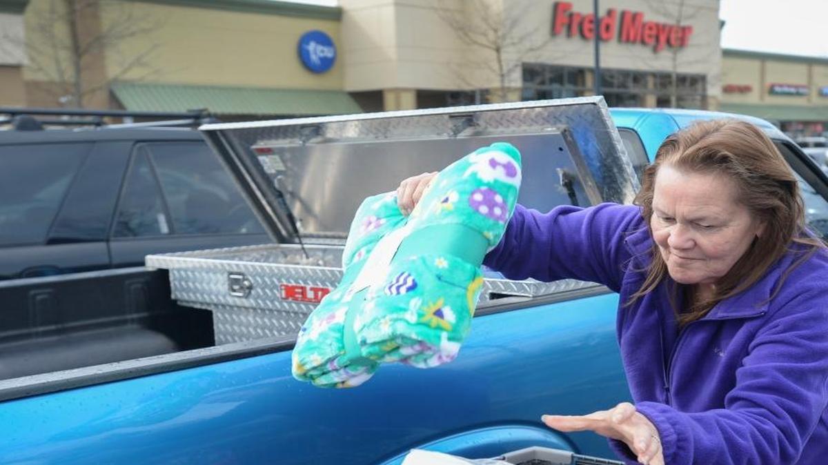 Lyn Hubbard of Bellingham unloads her grocery cart at the Fred Meyer grocery store on West Bakerview Road in March 2016. Fred Meyer is introducing online grocery pickup service for its Bellingham stores.
