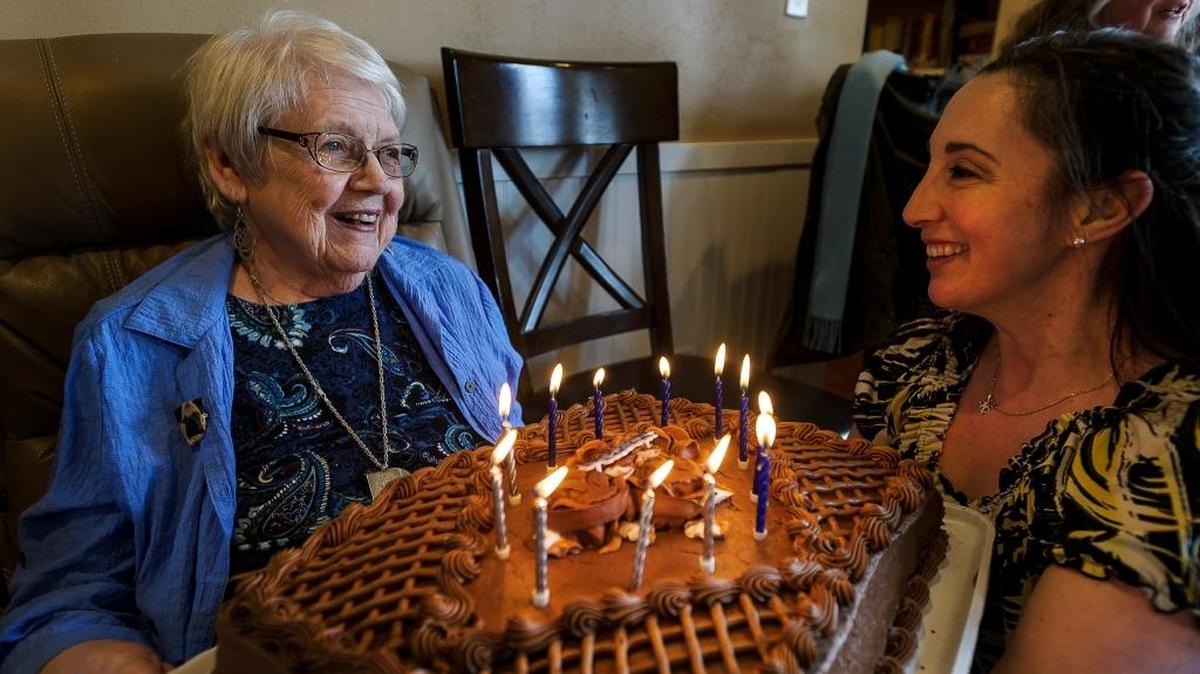 Adult Care Lynden resident Jane Rodgers, 86, is presented with a birthday cake by owner Kimberly Honorof at the assisted living facility at 925 East Front St.
