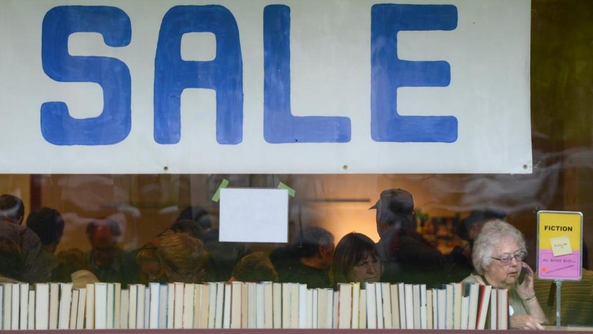 Donna Warren, 75, of Bellingham, at the annual Ski to Sea Book Sale in May at the Bellingham Public Library, looks for the adventure and romance novels she likes to read.