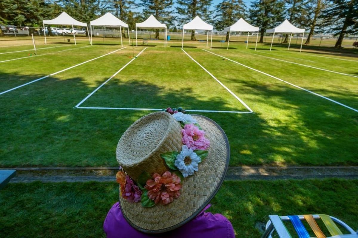 Pat Hanowell, 85, of Ferndale rests under the shade between rounds of the 2017 All County Bocce Tournament at Bender Fields on Monday morning August 28, 2017, in Lynden, Wash. Lynden senior center director Cathi LeCocq (cq) said 10 teams from the Lynden, Blaine, Bellingham, and Ferndale senior centers participated in the tournament. She said the seniors played to win “trophy and bragging rights” with the winner’s being named on the trophy.