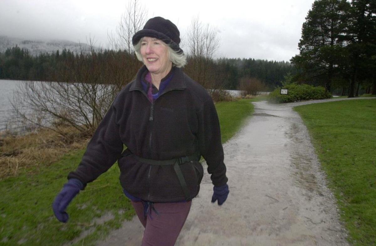 Bellingham resident Joan Casey takes a walk around Lake Padden in January 2002.
