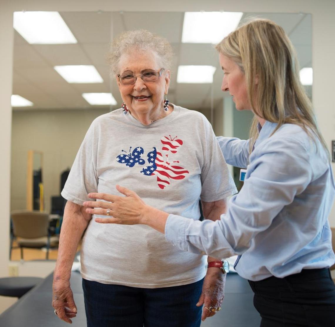 Sylvie De Rham Tortorelli, physical therapist, demonstrates fall prevention exercises with her former patient Jo Wagner on Friday, May 25, in Bellingham.