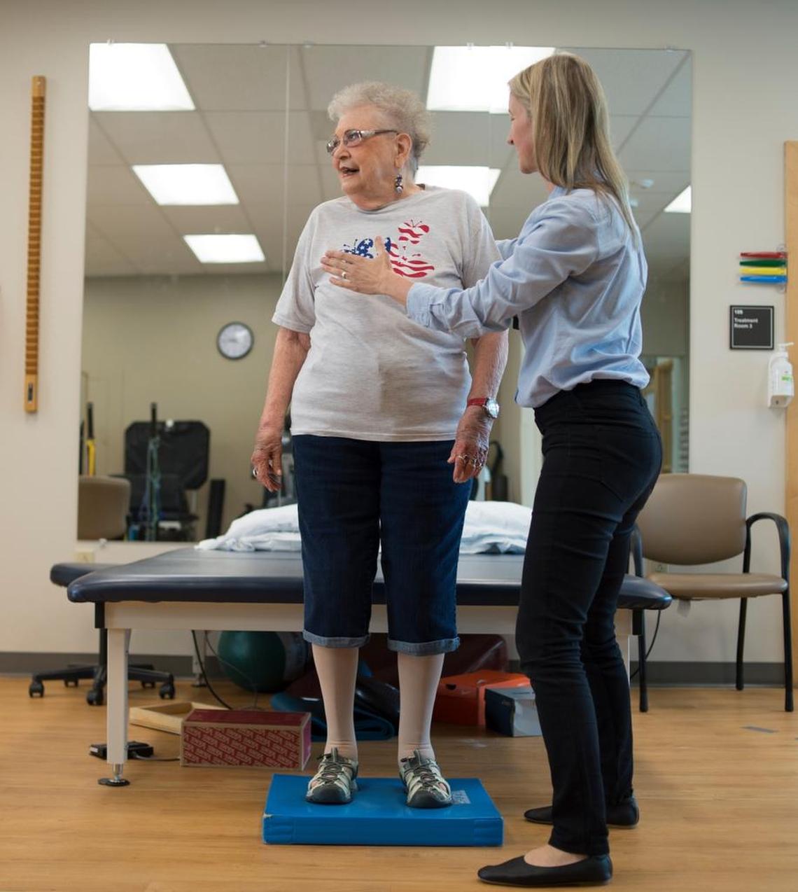 Sylvie De Rham Tortorelli, physical therapist, demonstrates fall prevention exercises with her former patient Jo Wagner on Friday, May 25, in Bellingham.
