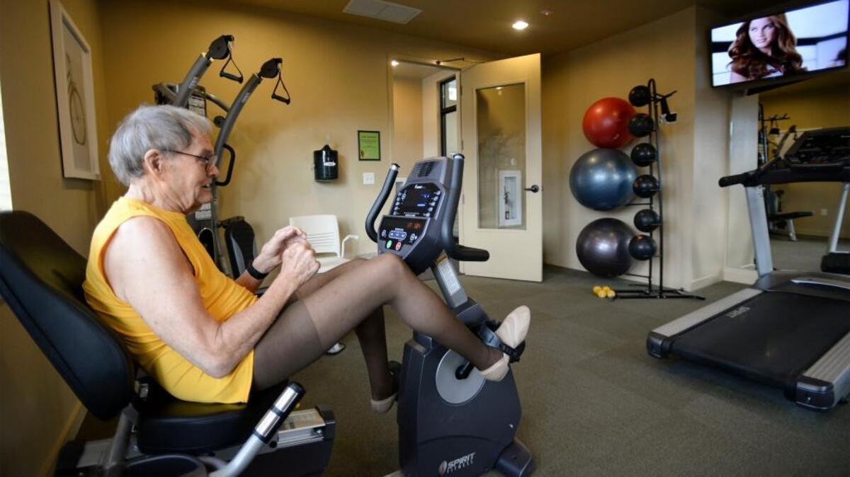 Retired economics professor John Huttman, 85, gets his daily workout in the exercise room at the Affinity at Bellingham. “As a economist, I think it is a good deal,” Huttman says.