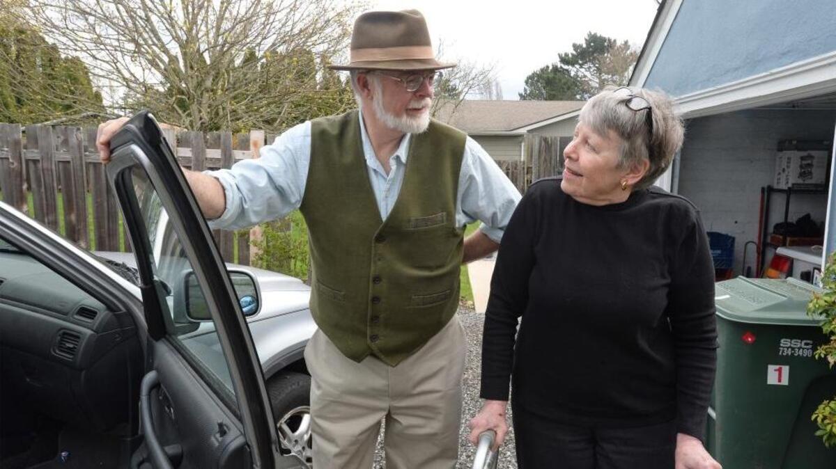 Richard Varner, 68, visits Mette Bang, 74, April 12 at her home in Bellingham. Varner volunteers through the Whatcom Volunteer Center, helping Bang, who suffers from multiple sclerosis, with transportation, chores and errands. Bang says without the help of the volunteers she would not be able to stay in her house.
