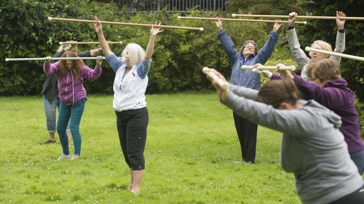 A longevity stick class works on the lawn at Bellingham Senior Activity Center.