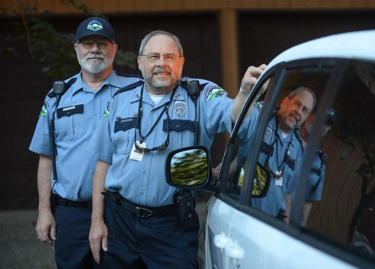 Ron Francis, 66, left, and Jim Tragesser, 72, are members of the Bellingham Police Department’s Retired Senior Volunteer Program. Volunteers assist the department by checking on the houses of vacationing residents as well as enforcing disabled parking rules within the city.