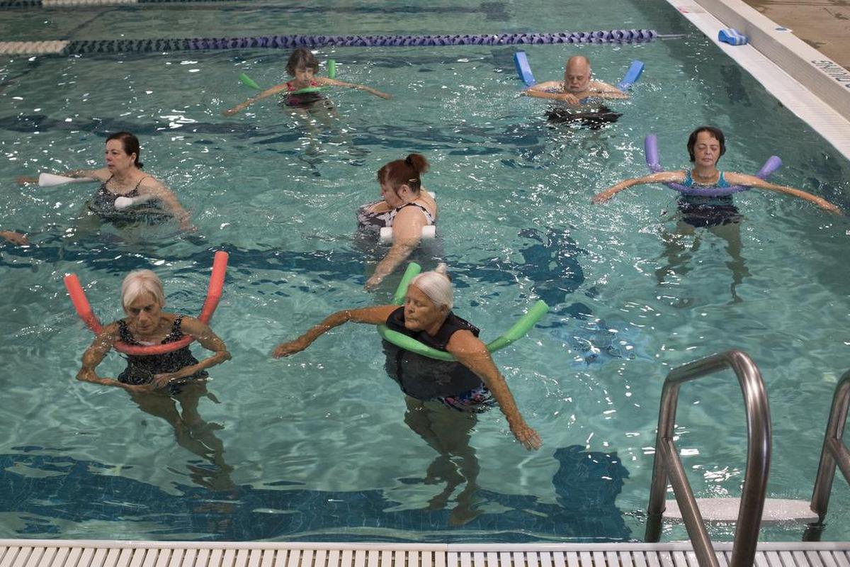 Participants in an arthritis exercise class follow the instructor’s directions at Arne Hanna Aquatic Center in Bellingham.