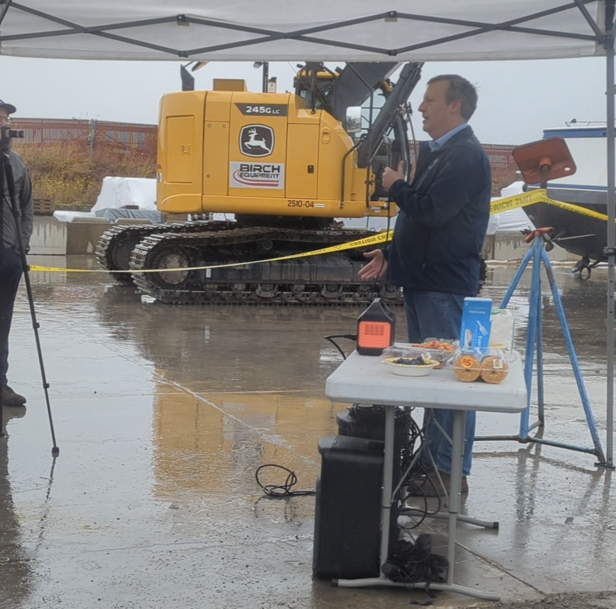 Newly-elected Commissioner of Public Lands Dave Upthegrove speaks to a crowd before the boat is deconstructed.