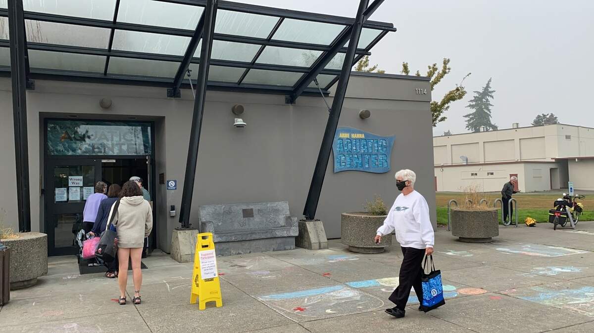 Swimmer enter the Arne Hanna Aquatic Center in Bellingham in 2020.