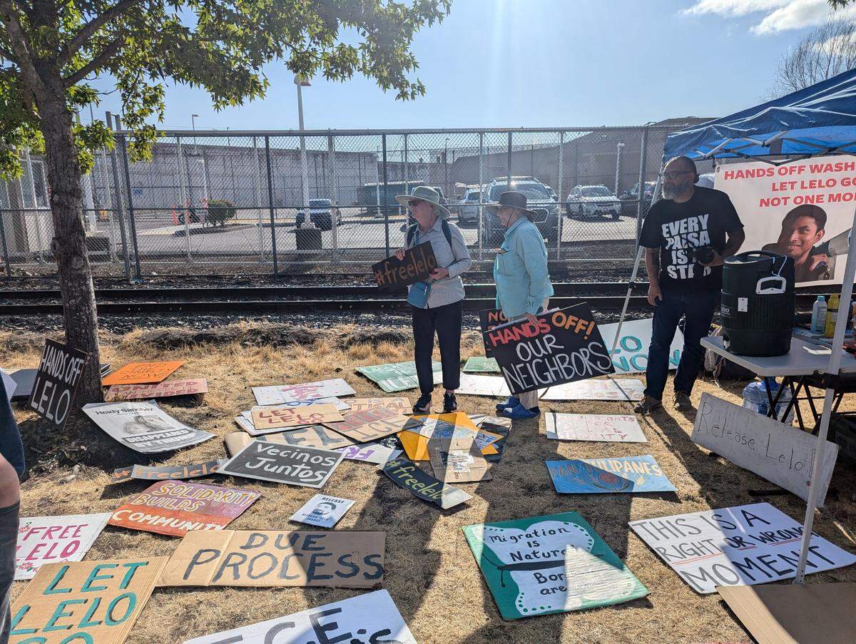 Protest signs were spread across the ground at the ICE detention facility.