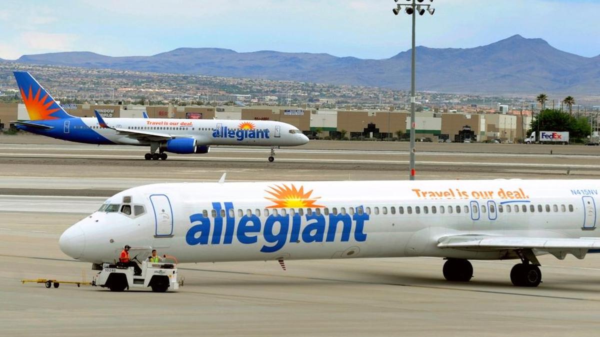 Two Allegiant Air jets taxi at McCarran International Airport in Las Vegas. Shares of Allegiant Air’s parent company tumbled Monday following a “60 Minutes” investigation that expressed serious safety concerns about the airline.
