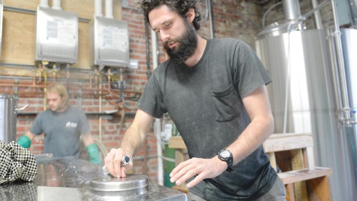 Co-owners Ryan Miller, left, and James Alexander brew a double IPA at the new Structures Brewing on State Street in Bellingham Thursday, Oct. 29, 2015. They plan to open the small brewery and tasting room in November.