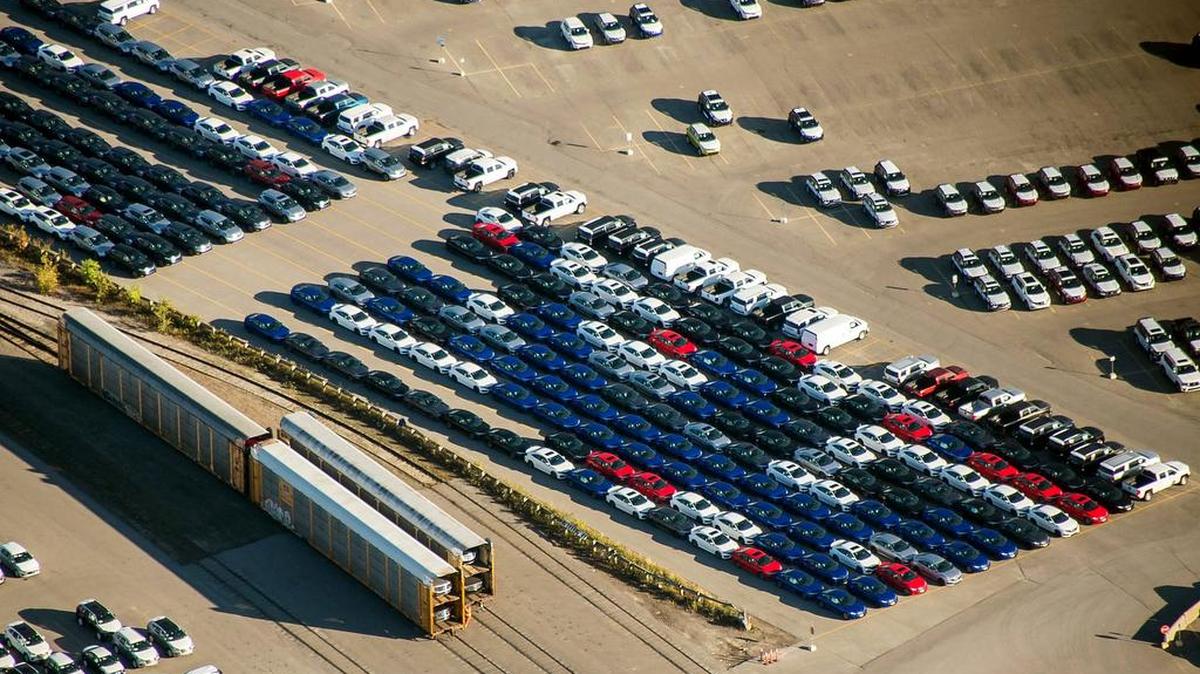 Vehicles sit parked near freight trains in a rail yard in this aerial photograph taken above Toronto in 2017. The Trump administration’s top trade official warned Tuesday that Canada was running out of time to join the United States and Mexico in a new North American Free Trade Agreement.