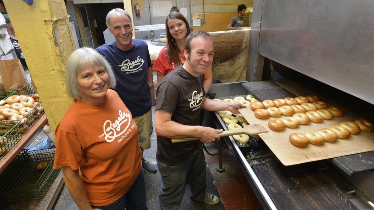 
The Bagelry owners Marguerite Ryan, left, her husband Ken Ryan and soon-to-be new owners Terra Seaton and husband Aaron Seaton at the downtown restaurant on Sept. 18, 2015. The Railroad Avenue restaurant is scheduled to officially change hands Jan. 1.

