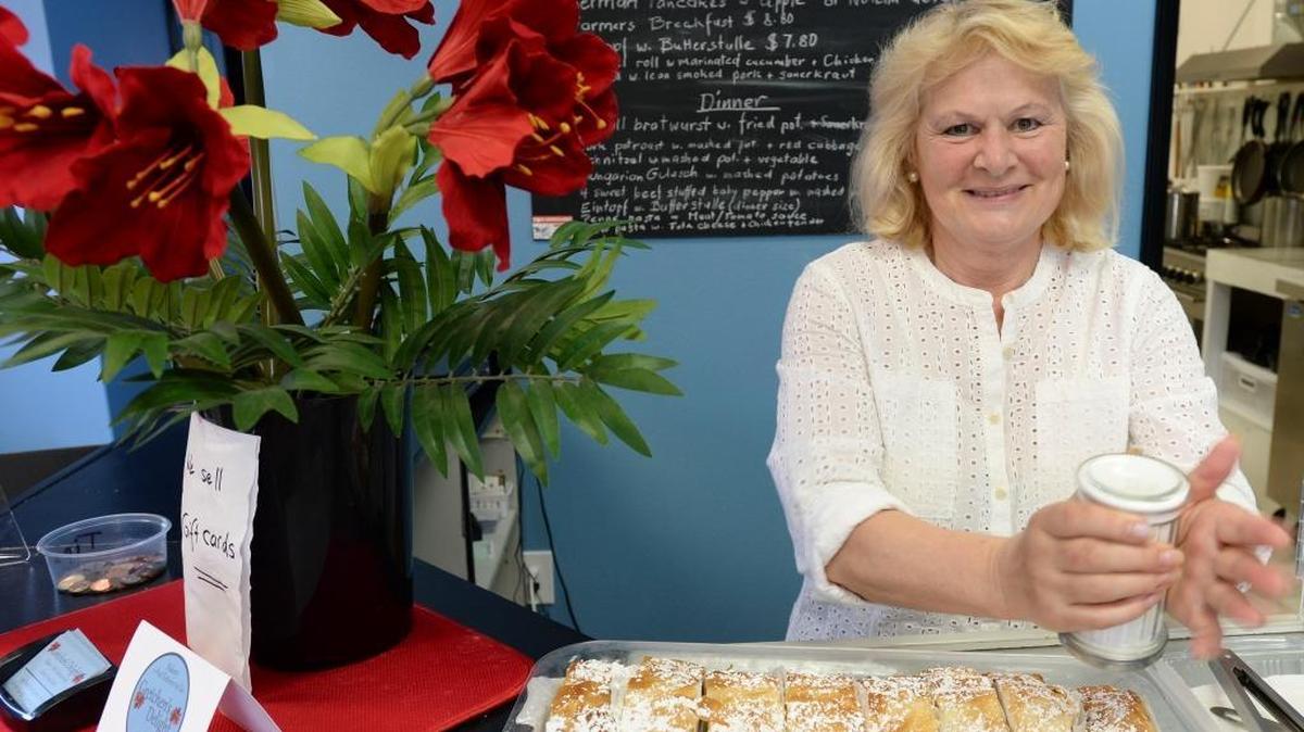 Owner Liesa Scott shakes powdered sugar on apple strudel Thursday, April 21, at Gretchen’s Delight, her Lynden restaurant on Front Street next to the Little Red Wagon children’s clothing store. The restaurant specializes in German, Austrian and Hungarian food.