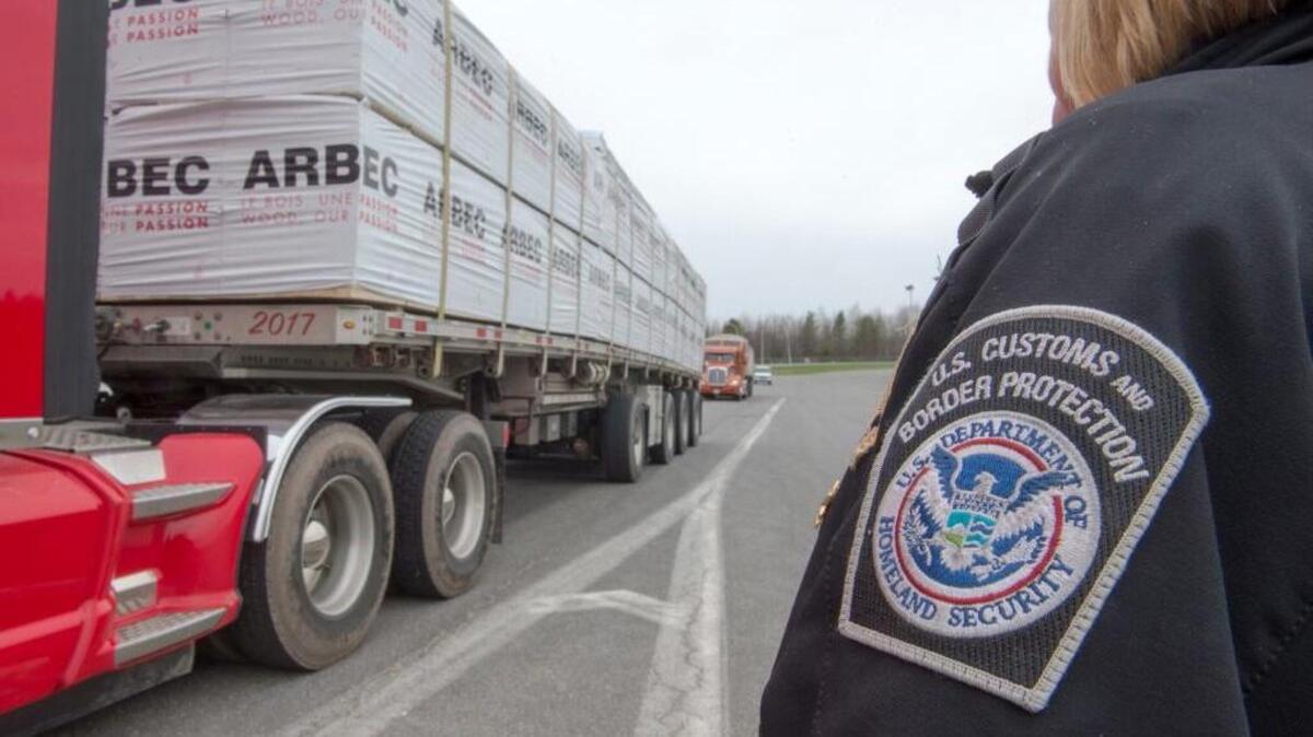 A truck carrying wood goes through the customs checkpoint, Tuesday, April 25, 2017 in Champlain, N.Y. Canadian Prime Minister Justin Trudeau says that Canada and the U.S. could suffer from what he called a “thickening” border, a day after the Trump administration imposed new tariffs on softwood lumber. Trudeau was responding to the announcement of new U.S. duties of up to 24 percent on softwood lumber entering from Canada.