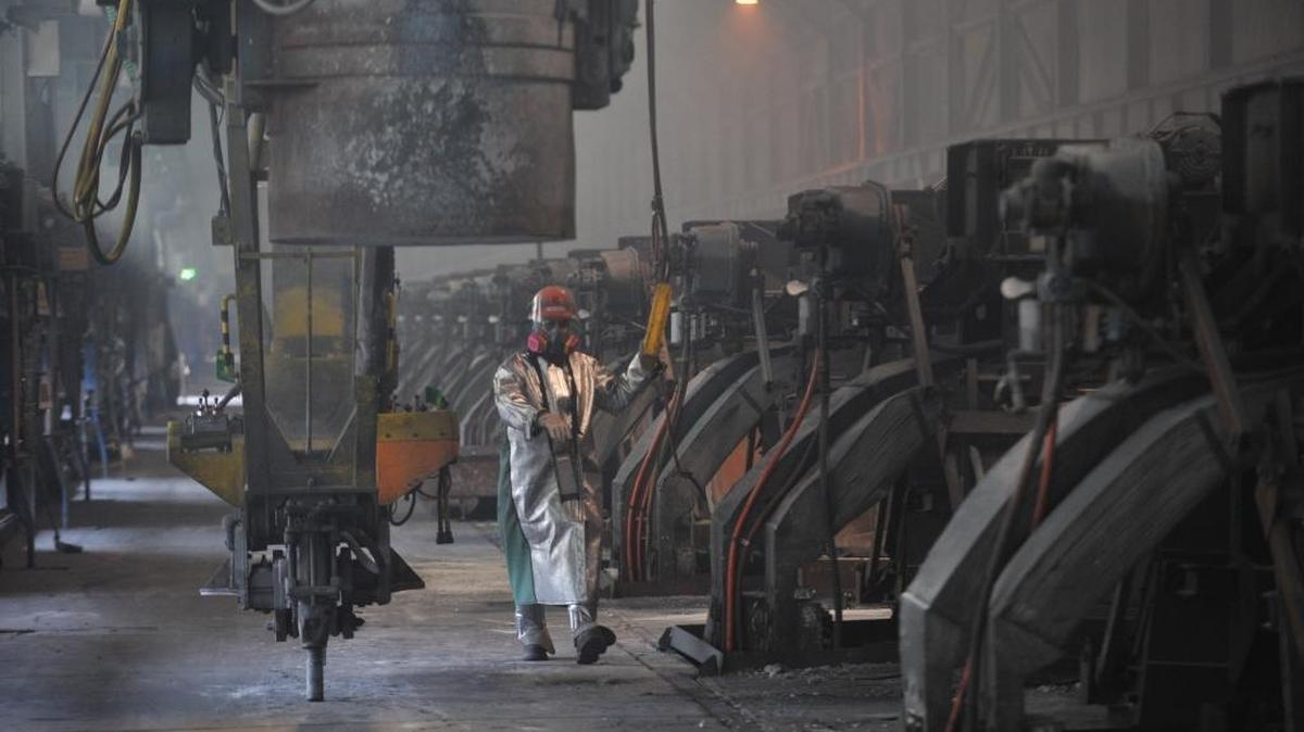 Workers start aluminum smelter pots at the Alcoa Intalco Works aluminum smelter west of Ferndale in 2011.