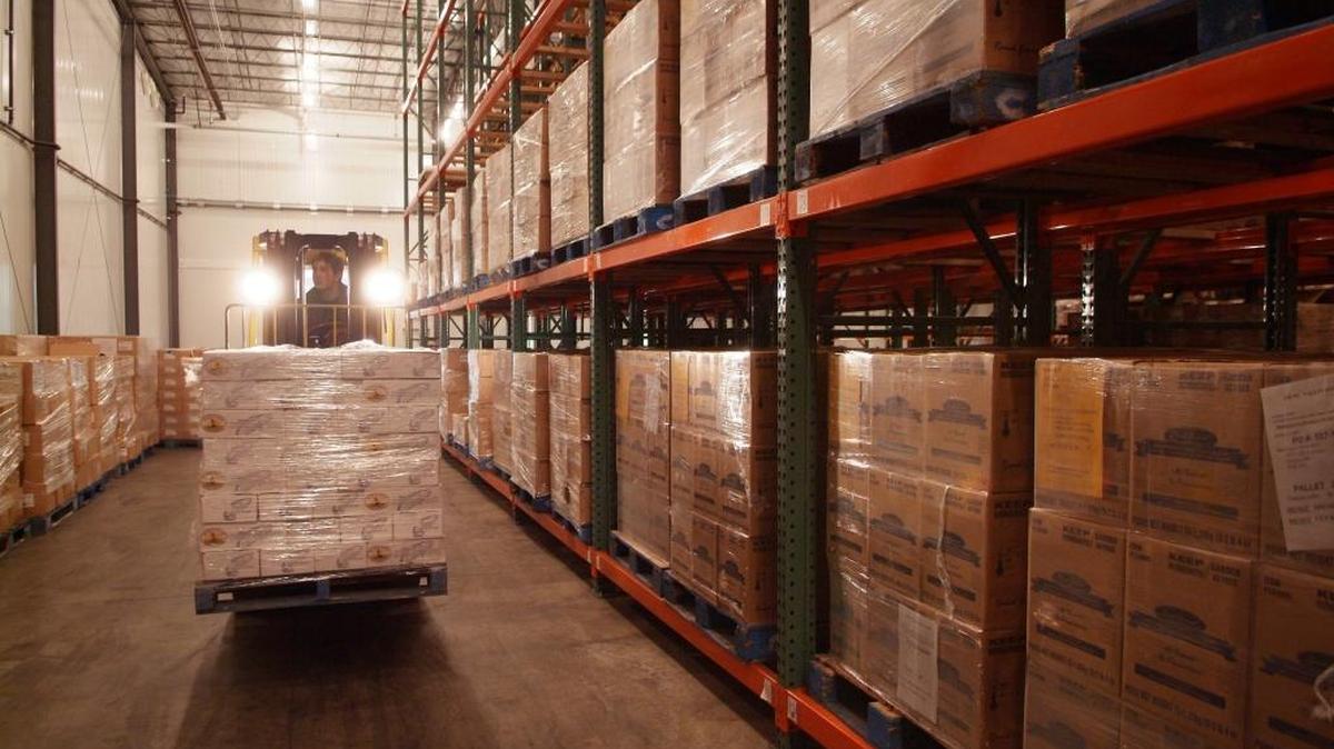 Josh Lange, assistant warehouse manager, moves a pallet of product at Blaine’s T.C. Trading Co. in this undated photo. T.C. Trading Co. recently received a $10 million funding agreement with the help of Opportunity Northwest.