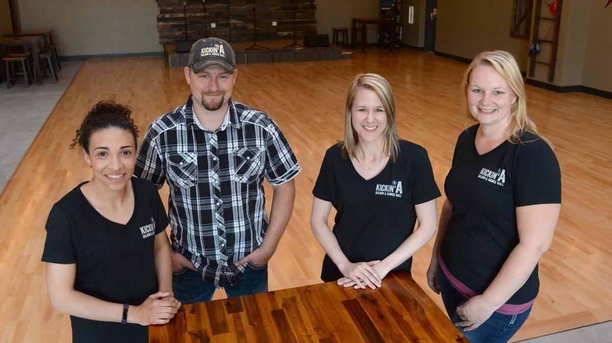 Bartender Mieschia Wilson, left, Dan Gavin, owner Jessie Anderson and Crystal Gavin at the new Kickin’ A Saloon and Dance Hall in Ferndale May 12, 2016. The country bar offers line dancing lessons and is open Tuesday through Saturday.