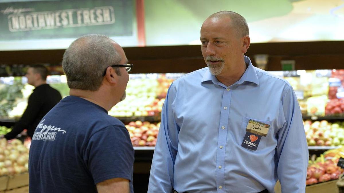
Haggen CEO John Clougher, right, talks with Barkley store manager Chris Sharick at the store in Bellingham on Sept. 19, 2014. Supermarket giant Albertsons has filed a lawsuit against Haggen, accusing the grocer of fraud in failing to pay more than $36 million as part of the sale of 146 grocery stores. Most of the stores sold are in California and Arizona.
