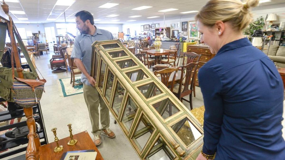 Co-owners Randall Wick and and Kelly Harrison move furniture in the new Bellingham Coin Shop on Cornwall Avenue on Thursday, Jan 14, 2016.