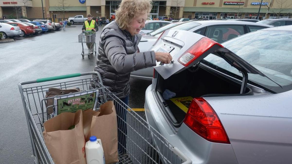 Caroline Balzer of Bellingham unloads her grocery cart at the Fred Meyer grocery store on West Bakerview Road in Bellingham on Monday, March 21, 2016. Fred Meyer is introducing an online grocery pickup service for its Bellingham stores. “I think it’s a good idea,” Balzer said.