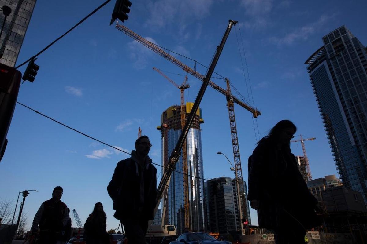Construction cranes on Nov. 6, 2017, in Seattle, which experienced a boom after Amazon was founded in the city. For Seattle, Amazon has become far more than a big employer and taxpayer. It has reshaped how the city sees itself and, in turn, is seen by the world.