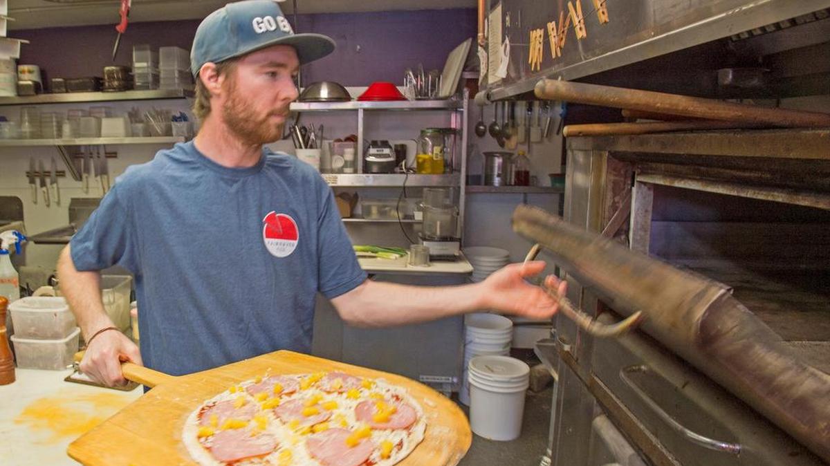 Former owner James Wadkins makes pizza at Fairhaven Pizza in Bellingham in 2015. Current owner Emile Diffley is closing the restaurant Sunday, March 13, but plans to reopen a new eatery at the location later this year.