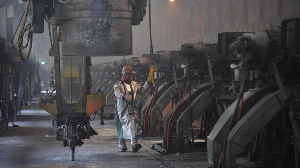 Workers start aluminum smelter pots on potline B at the Alcoa Intalco aluminum smelter west of Ferndale Feb. 15, 2011.