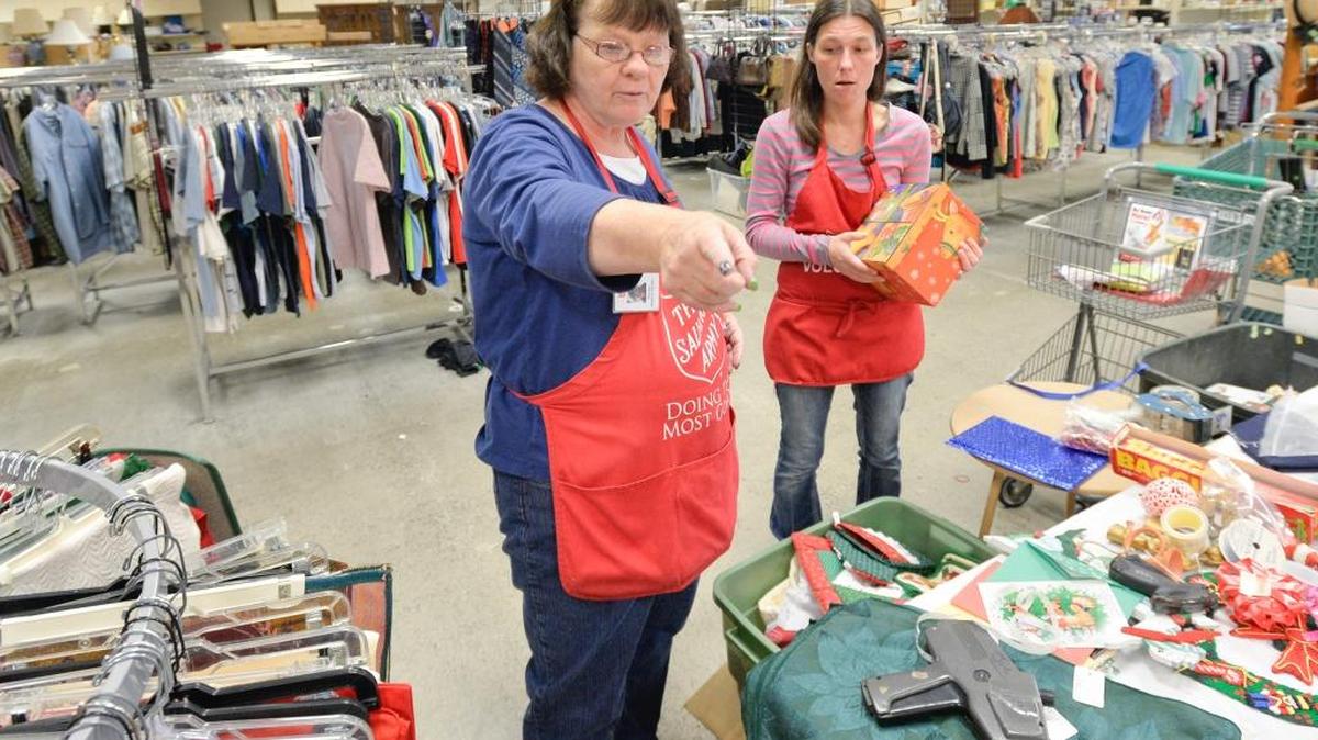 Employee Shirley LaPlante, left, tells volunteer Michelle Parmenter where to put a box at the Salvation Army store on Birchwood Avenue in Bellingham on Wednesday Nov. 4, 2015.