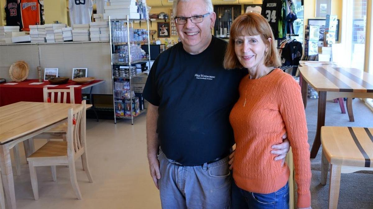 Owners Joe and Joyce Miles stand in the new location of Miles Woodworking and Joe’s Sports Memorabilia at 1201 11th St., Fairhaven, Friday, Feb. 17, 2017. Their son, Joe Miles, makes all the wood furniture.