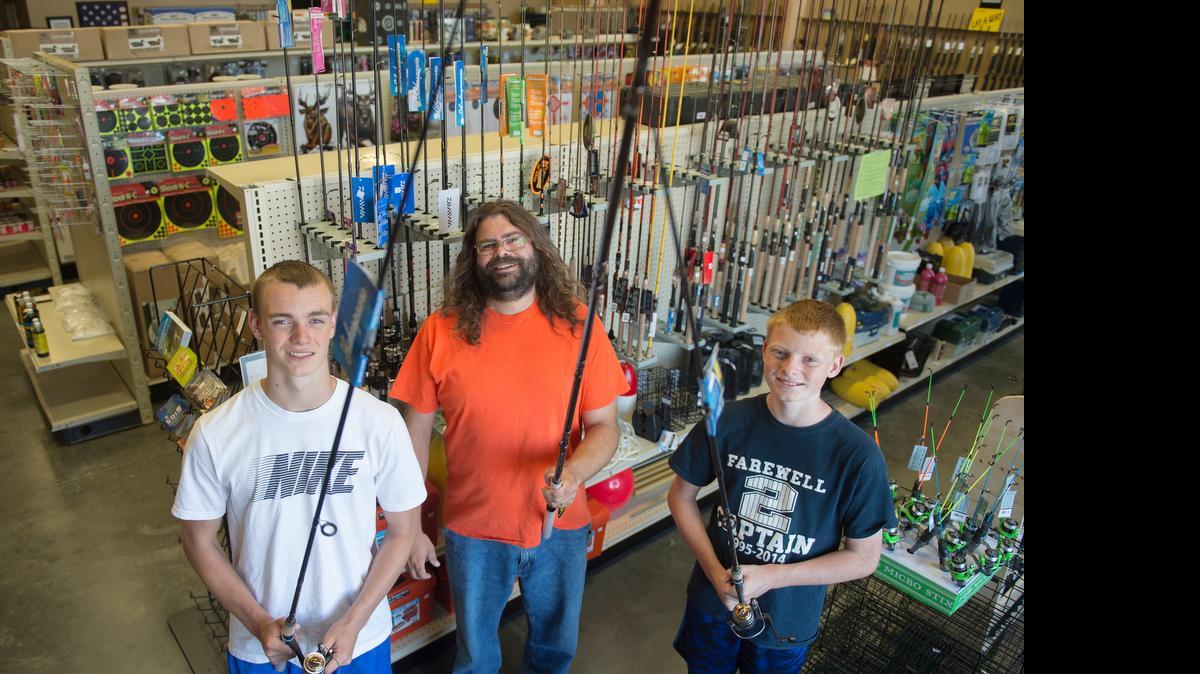 
Cody Gunter, left, fishing department manager Eli Michael and Kyle Gunter in the new fishing department at Dakota Creek Guns and Outfitting in Ferndale on Wednesday, June 17, 2015. The store recently added about 1,000 square feet of fishing supplies.
