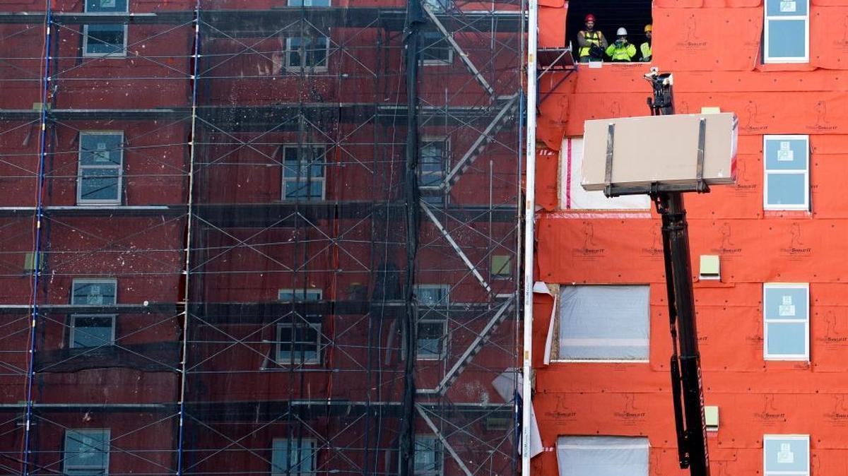 Construction crews work on the 145-unit, 423-bed Gather Bellingham building on North Forest Street on Wednesday, Jan. 11, 2017.
