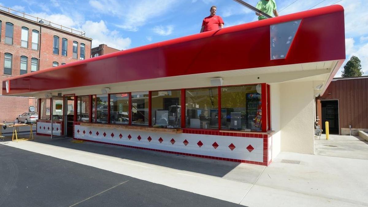 Signs Plus installers Levi Ashcroft, left and Ben Strom work on the front of the new Zane Burger in the Fairhaven district of Bellingham, Thursday, Sept. 8, 2016. The restaurant is scheduled to open later this month.