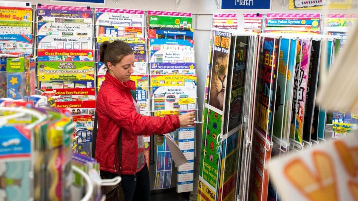 Gracie Woolley, a teacher at Madison Elementary in Mount Vernon, browses classroom posters at Launching Success on Wednesday, Aug. 3, in Bellingham.