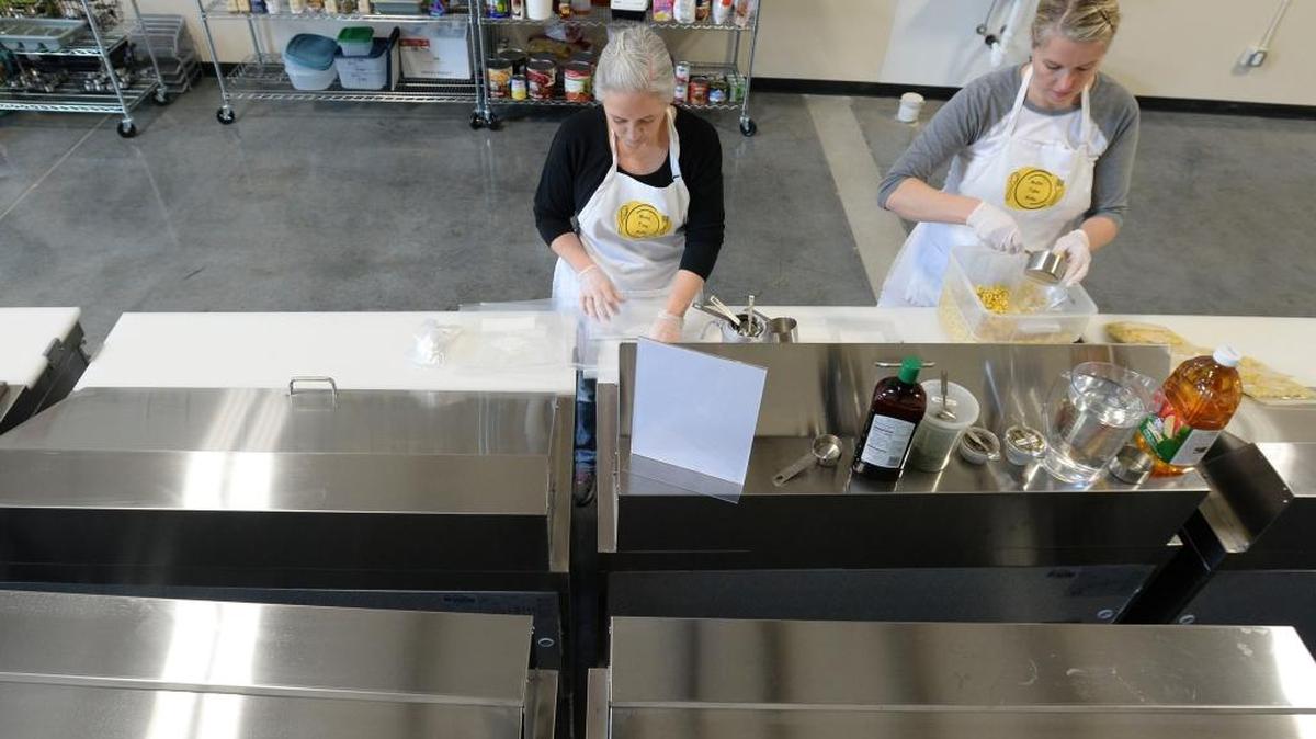 Co-owners Jane Holland, left, and Debbie Hughes sort ingredients for tortellini soup at their new business, Make Take Bake, on Hannegan Road south of Lynden on Thursday, March 3, 2016.