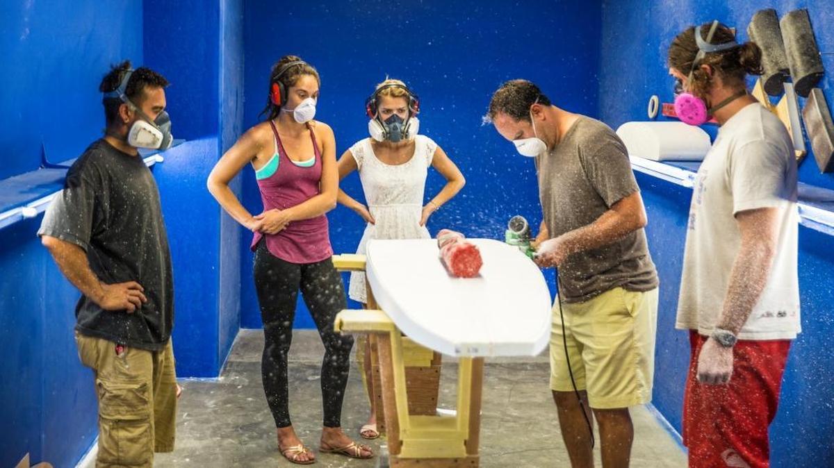Stephan Aarstol, second from right, works on a board for his company, Tower Paddle Board, in this undated photo. Aarstol’s company will be featured on the television show “Beyond the Tank,” on ABC at 8 p.m. Thursday, Jan. 28.